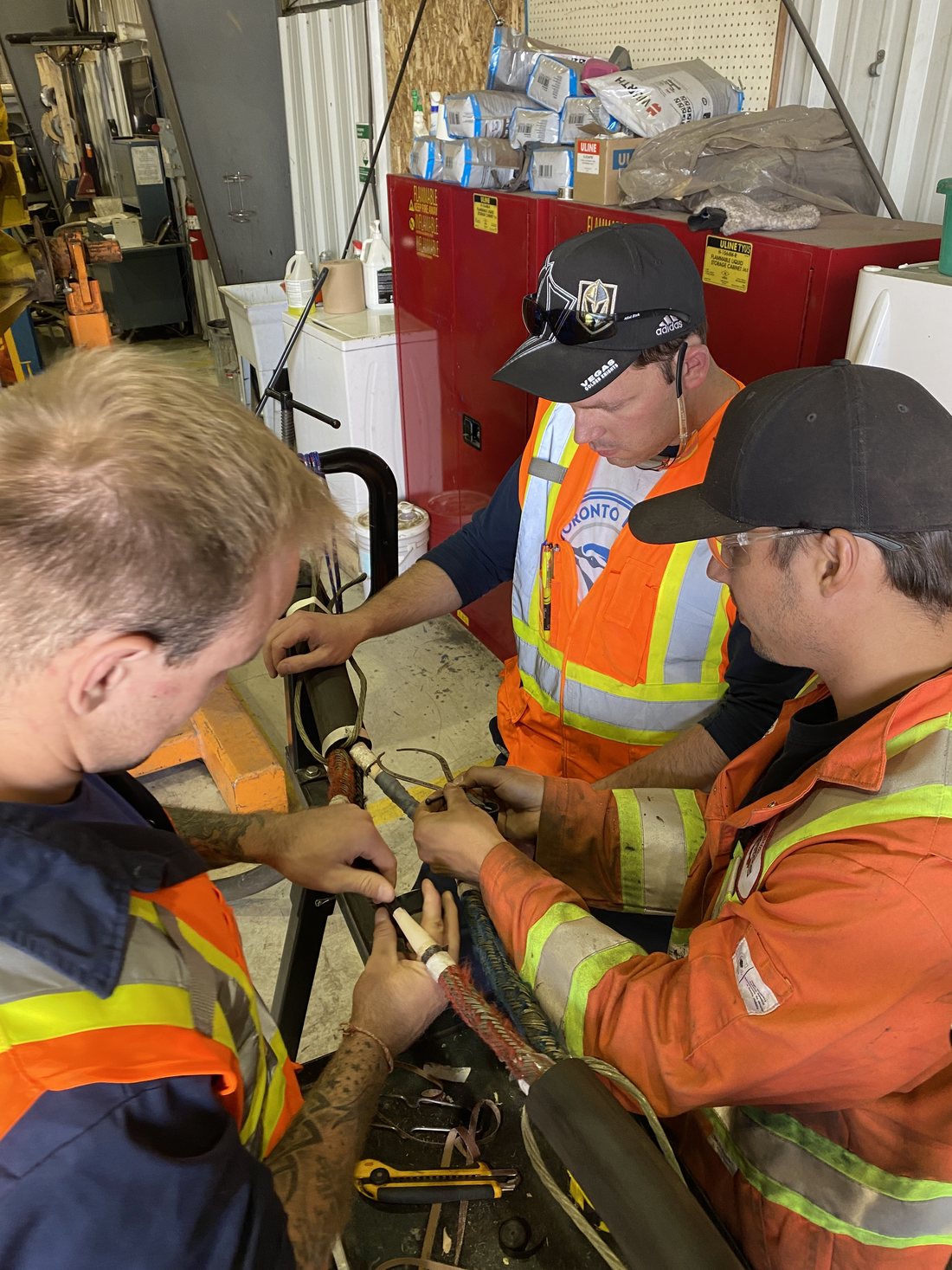 Rogers technicians repairing cable conductors