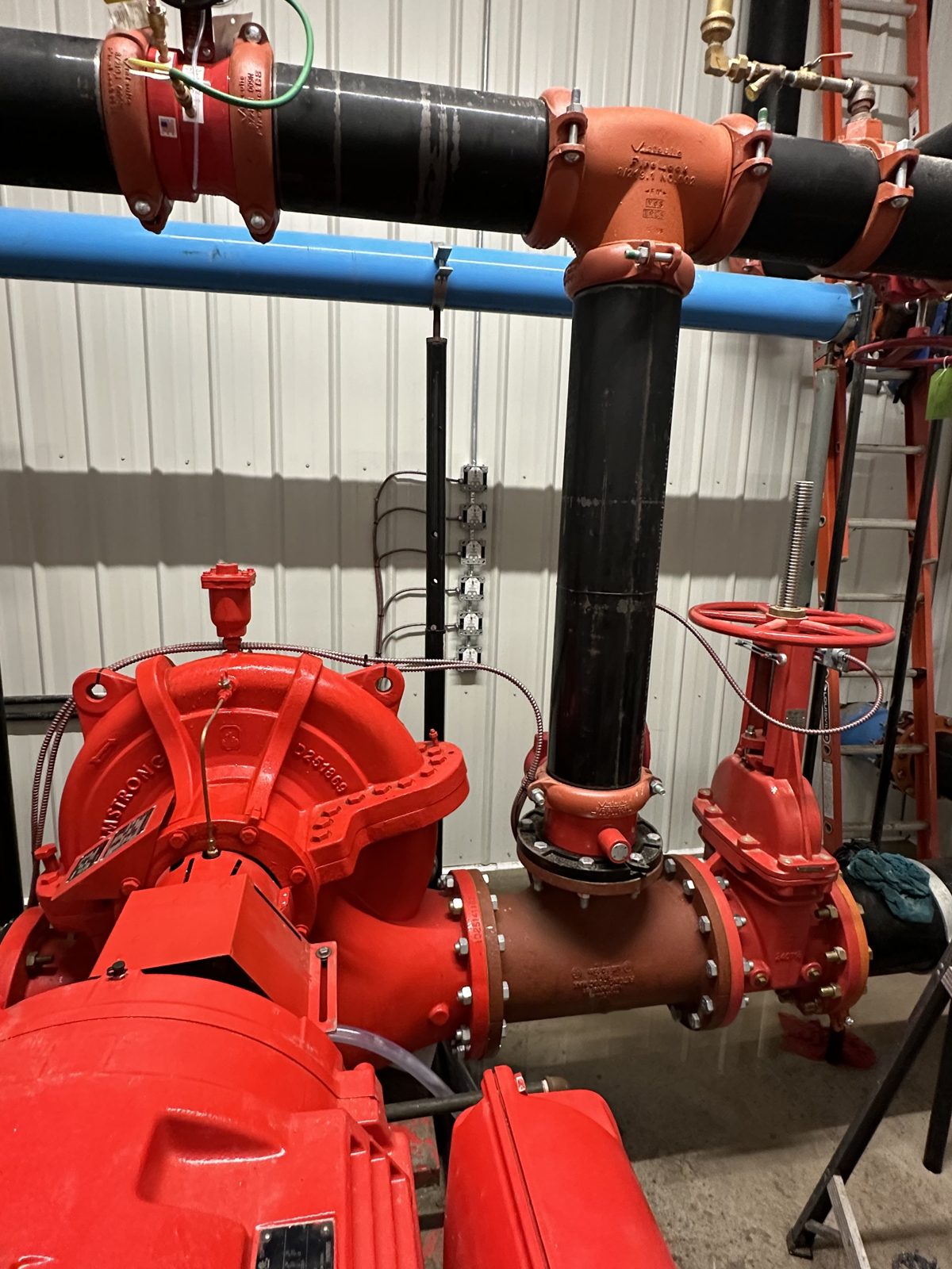 Electric fire pump and piping installed by Rogers