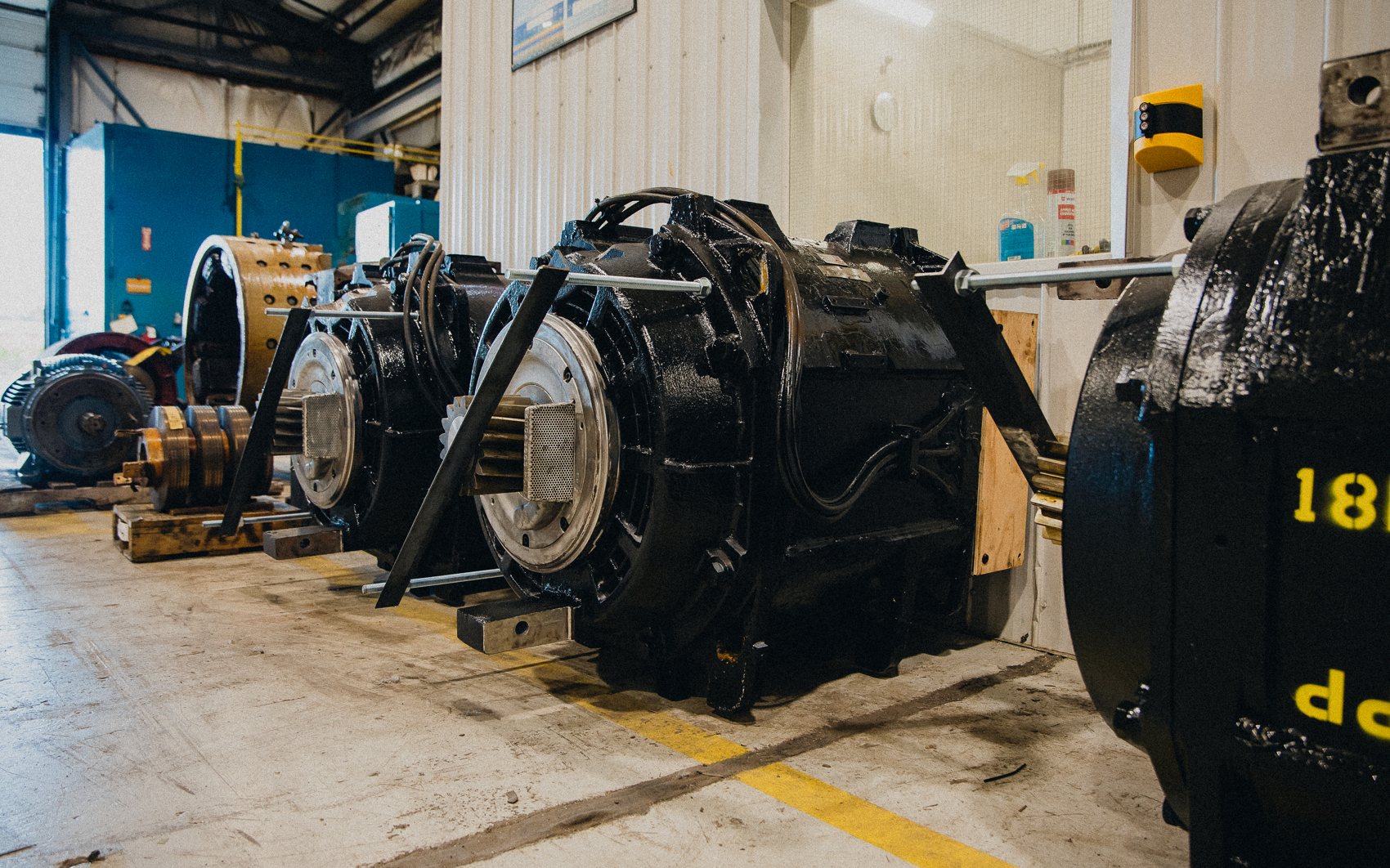 Traction motors lined up on the shop floor at Rogers